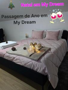 a bedroom with a bed with christmas decorations on it at My Dream in Penha Garcia