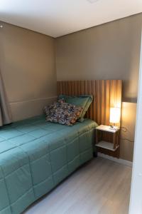 Postel nebo postele na pokoji v ubytování Apto Pet Friendly com Garagem no Centro