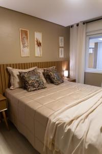 Postel nebo postele na pokoji v ubytování Apto Pet Friendly com Garagem no Centro