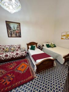 Postel nebo postele na pokoji v ubytování Riad Dar Babouche