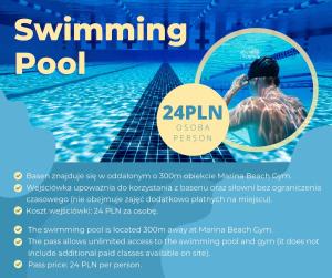 a poster of a swimmer in a pool at Apartamenty Gdansk EU- Apartamenty Jelitkowska 11, 200m od morza in Gdańsk