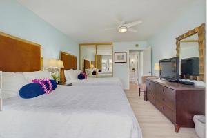 Ένα ή περισσότερα κρεβάτια σε δωμάτιο στο Plantation Hale H3 +13 φωτογραφίες