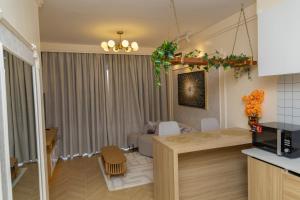 Kuchyň nebo kuchyňský kout v ubytování ADASHA Homes + 9 fotografií