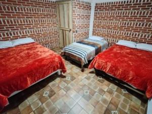 Ένα ή περισσότερα κρεβάτια σε δωμάτιο στο Cabañas Aruba