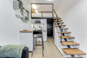a staircase in a tiny apartment with a kitchen at City Apartments in Tallinn