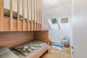 a bedroom with a bunk bed under the stairs at Family Apartment Bovec with Free Parking in Bovec
