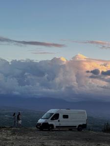 a white van parked on top of a hill at campers georgia in Kutaisi