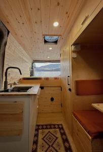 a small kitchen with a sink and a counter at campers georgia in Kutaisi