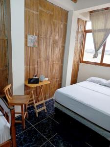 Ένα ή περισσότερα κρεβάτια σε δωμάτιο στο Casa Emanuel en Montañita