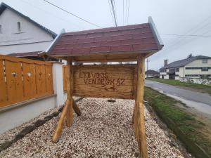 a wooden structure with a roof on top of it at Lebujos Vendégház in Boldogkőváralja +2 photos
