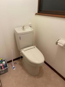 a bathroom with a white toilet in a room at 信の宿 花巻 in Hanamaki +41 photos