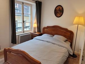 Postel nebo postele na pokoji v ubytování Les appartements Place de la Cathédrale