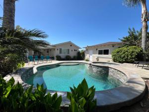 a swimming pool in the backyard of a house at Destination #23 in Anaheim