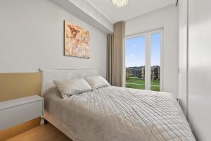 Postel nebo postele na pokoji v ubytování Brand-New Luxury Apartment with Sea View + 22 fotografií