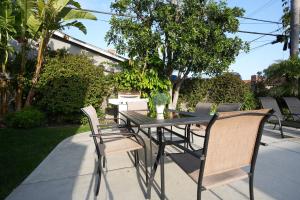 a black table and chairs on a patio at Destination #06 in Anaheim