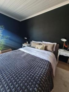 Postel nebo postele na pokoji v ubytování Tradewinds Guest House + 13 fotografií