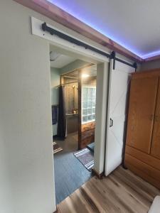 Ένα ή περισσότερα κρεβάτια σε δωμάτιο στο The Stable