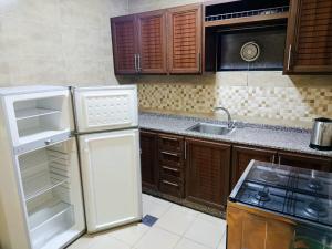 Η κουζίνα ή μικρή κουζίνα στο Siveen Hotel