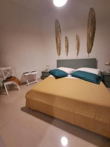 Ένα ή περισσότερα κρεβάτια σε δωμάτιο στο ORTIGIA LUXURIs DOMUs