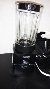 a black blender sitting on top of a table at Apartment in city center in Daugavpils