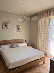 Postel nebo postele na pokoji v ubytování Appartamento Gardenie Vista Mare Relax