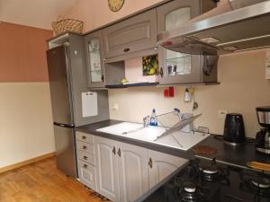 Kuchyň nebo kuchyňský kout v ubytování Сocon bien douillet