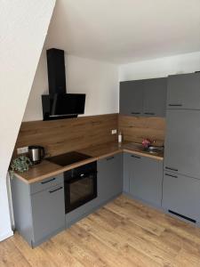 Кухня или мини-кухня в Zweistöckige Wohnung im weissen Lamm
