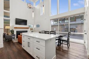 a kitchen and dining room with a table and chairs at Quarry B5 in Whitefish +16 photos