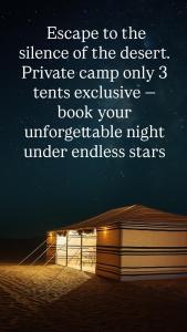 a book sitting on the beach next to at Aurora desert camp wahiba sands in Bidiyah