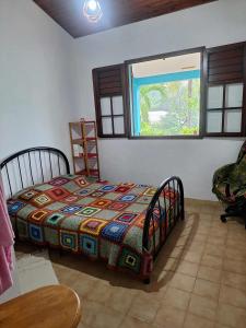 Ένα ή περισσότερα κρεβάτια σε δωμάτιο στο Kay Thaleya Chez l'habitant aux Trois Ilets