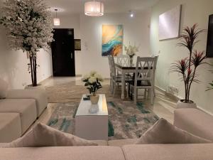 a living room with a couch and a table at Madinaty Home in Madinaty