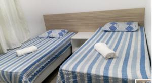 En eller flere senge i et værelse på Apartamento Luxo zona sul Ilhéus piscina academia sauna + 29 billeder