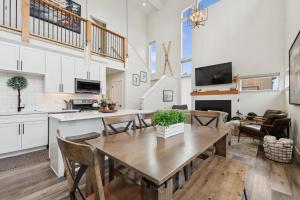 a kitchen and living room with a wooden table and chairs at Quarry B10 in Whitefish