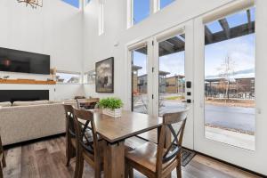 a dining room with a table and chairs and a couch at Quarry B10 in Whitefish