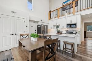 a kitchen and dining room with a table and chairs at Quarry B10 in Whitefish +41 photos
