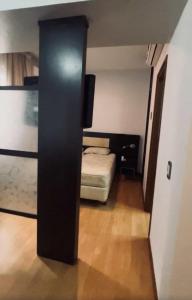 Ένα ή περισσότερα κρεβάτια σε δωμάτιο στο MONOAMBIENTE Del Bono