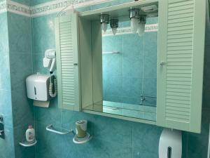 a bathroom with a mirror and a sink at B&K Hotels in Milan +27 photos