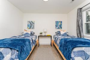 En eller flere senge i et værelse på Cozy Escape 908