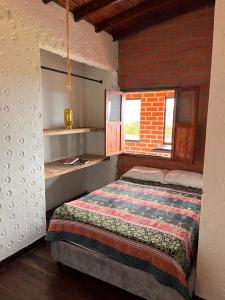 Ένα ή περισσότερα κρεβάτια σε δωμάτιο στο Eco Hostal Arroyave