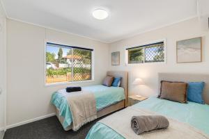 En eller flere senge i et værelse på Modern Comfort in Quiet Neighbourhood!