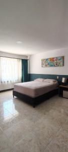 Postel nebo postele na pokoji v ubytování La iguana café y más