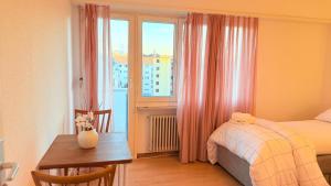 Ένα ή περισσότερα κρεβάτια σε δωμάτιο στο Hostel City Basel 308 +29 φωτογραφίες