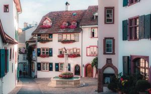 an alley in an old town with buildings at Hostel City Basel 308 in Basel
