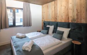 Ένα ή περισσότερα κρεβάτια σε δωμάτιο στο Chalet Für 8 Personen +15 φωτογραφίες