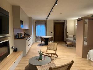 a kitchen and living room with a table and chairs at Xaneira in Finisterre