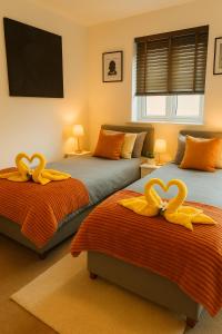 En eller flere senge i et værelse på Oakham stay