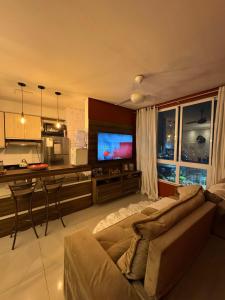 Et tv og/eller underholdning på Apartamento Familiar Para Suas Férias