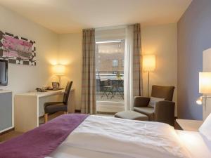 Ένα ή περισσότερα κρεβάτια σε δωμάτιο στο Mercure Hotel Berlin City West