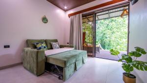 a bedroom with a bed and a large window at Villa Alma Verde in Fortuna