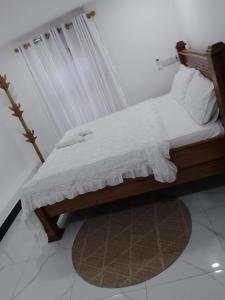 Ένα ή περισσότερα κρεβάτια σε δωμάτιο στο Kahawa apartment